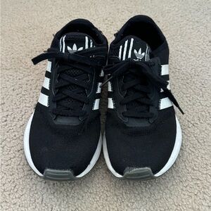 Adidas black sneakers with white stripes